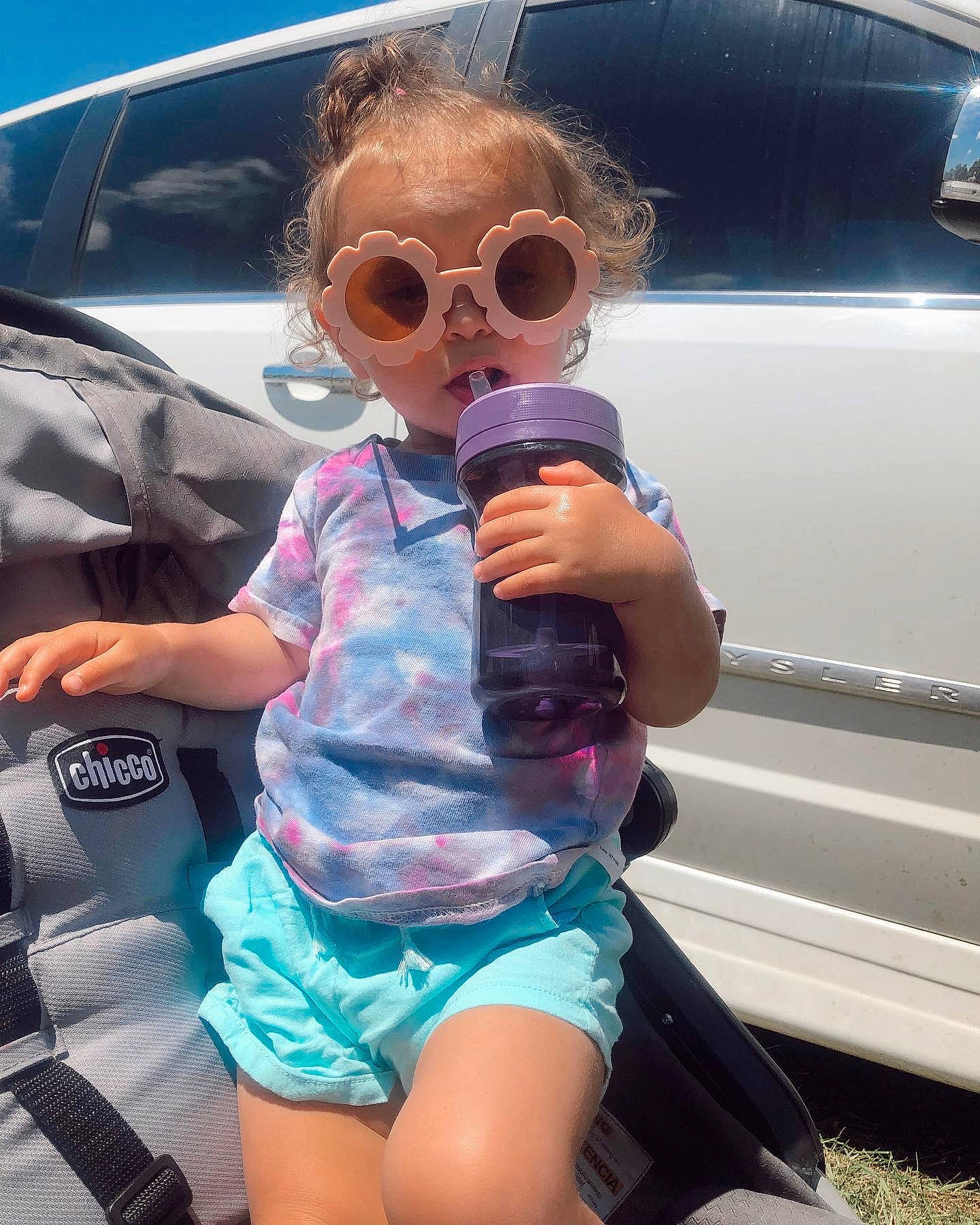Sage is registered to the contest to win money with this photo: automotive_design, automotive_exterior, automotive_lighting, bumper, cool, eyewear, fun, happy, hood, leisure, motor_vehicle, mouth, person, recreation, shorts, skin, summer, sunglasses, toddler, travel