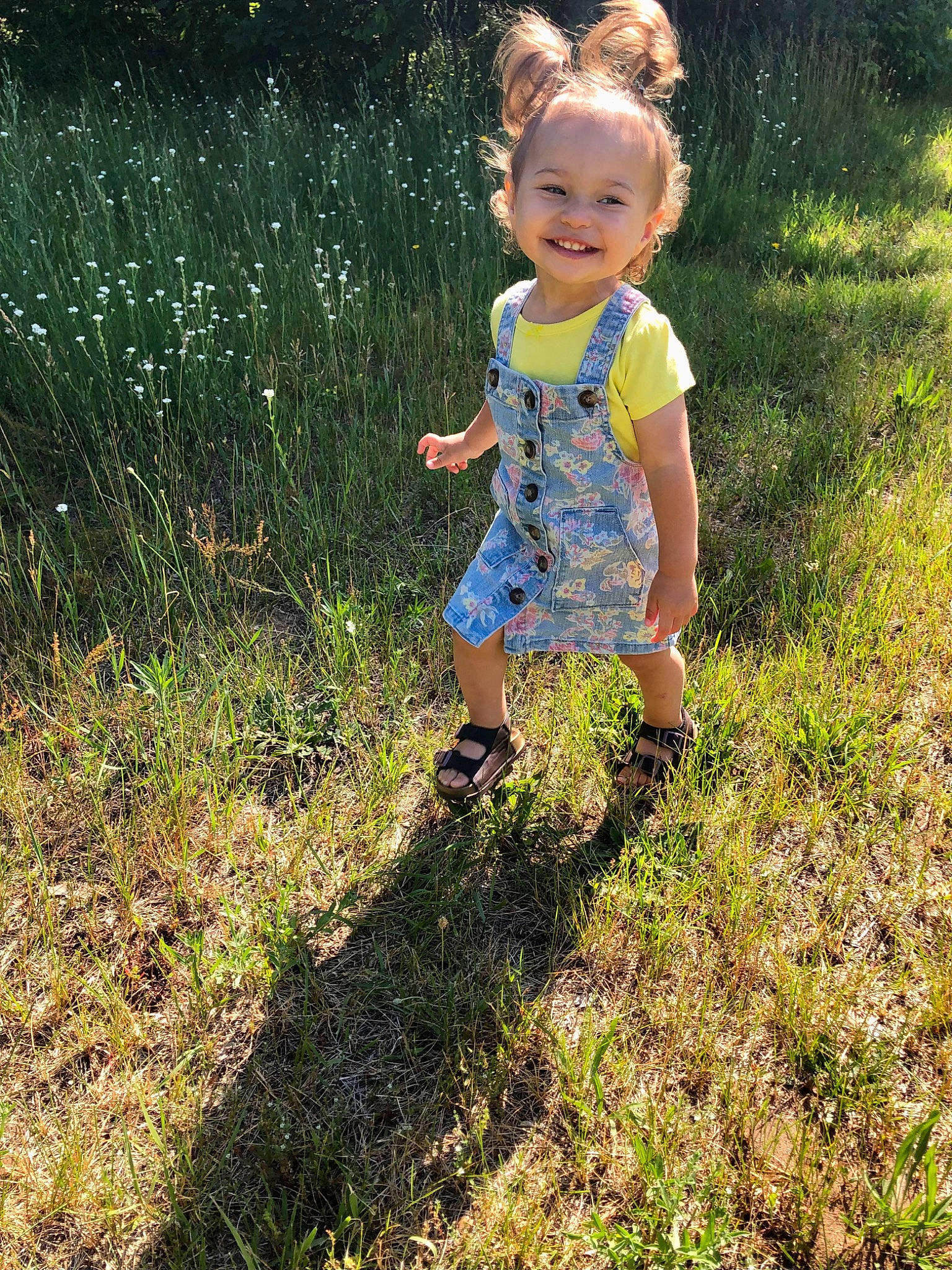 Sage is registered to the contest to win money with this photo: baby_toddler_clothing, fun, garden, grass, grassland, groundcover, happy, human_body, joy, landscape, lawn, leisure, meadow, people_in_nature, person, plant, prairie, smile, sunlight, tints_and_shades