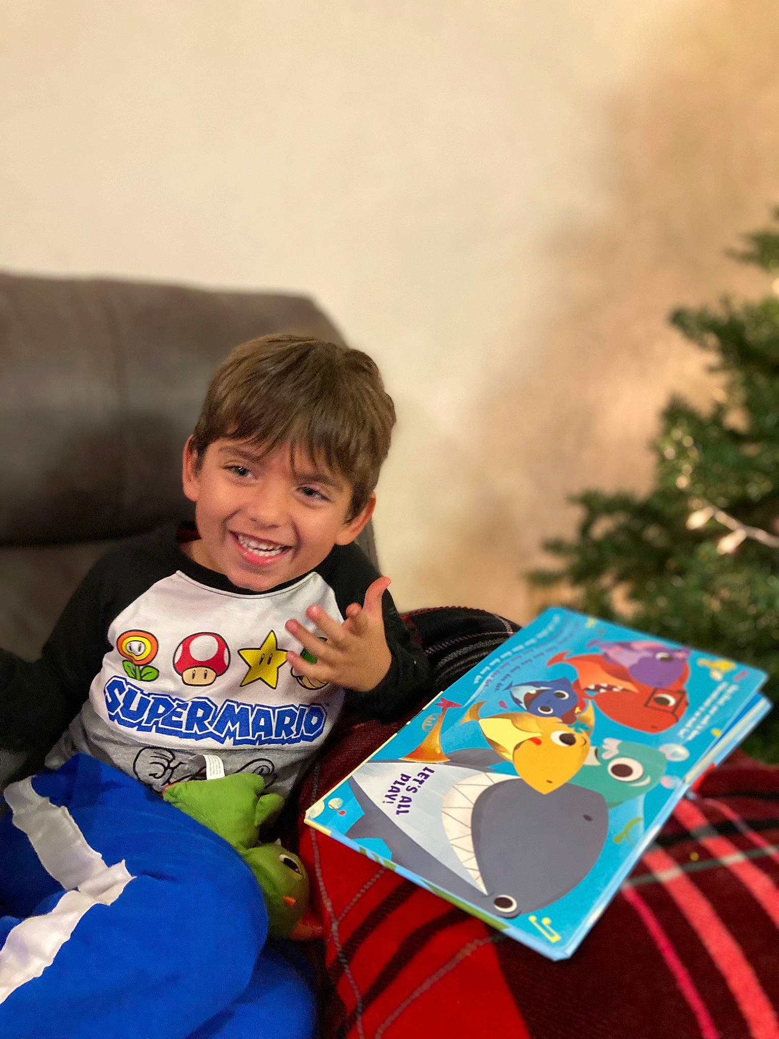 Kasen is registered to the contest to win money with this photo: baby, baby_toddler_clothing, child, couch, event, fun, games, happy, holiday, joy, leisure, people, person, play, recreation, room, sitting, sleeve, smile, t_shirt