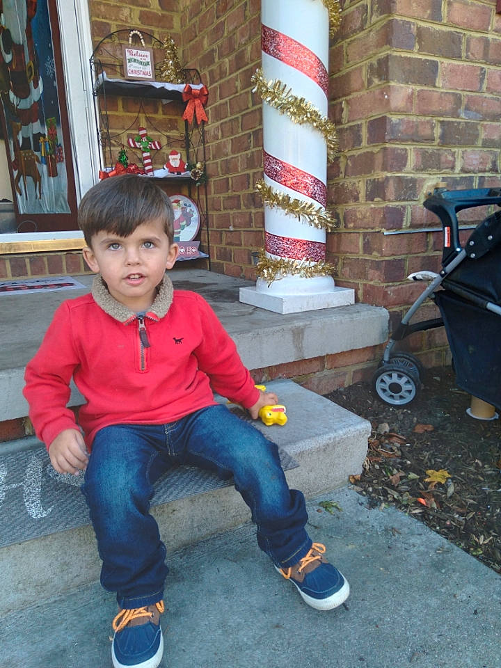 Kamden joined the competition — help win amazing prizes! child, denim, electric_blue, flooring, fun, gas, jeans, leisure, person, road_surface, sandal, sidewalk, sitting, standing, street, toddler, travel, vacation