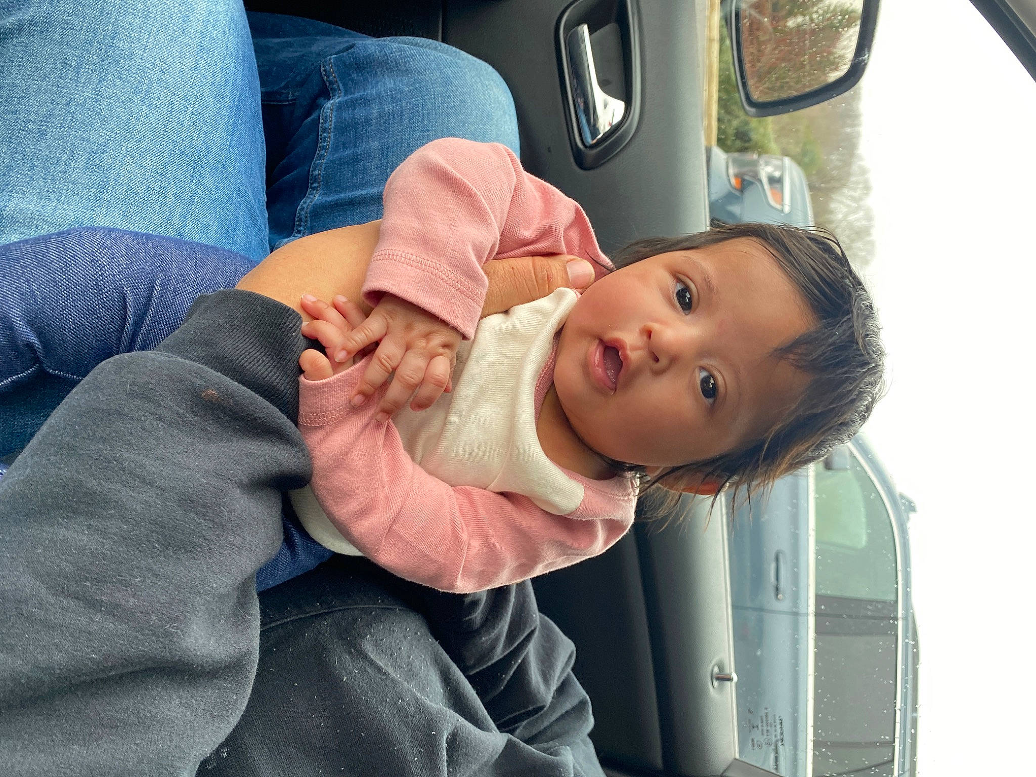 Cecilia is registered to the contest to win money with this photo: auto_part, automotive_exterior, automotive_lighting, baby, baby_toddler_clothing, car, car_seat, child, comfort, eye, family_car, gesture, motor_vehicle, person, skin, smile, thumb, toddler, vehicle, vehicle_door