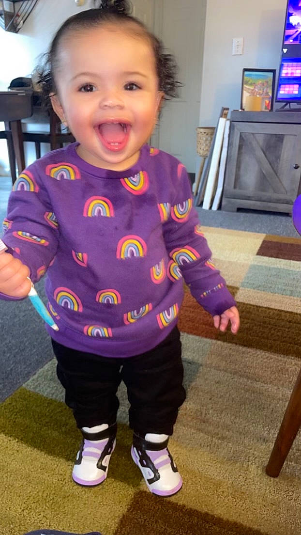 Alani joined the competition — help win amazing prizes! baby_toddler_clothing, cheek, cool, fun, hair, happy, head, iris, joint, nose, person, pink, purple, shoulder, skin, sleeve, smile, standing, television, television_set