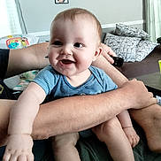 River is registered to the contest to win money with this photo: baby, bodypart, clothing, couch, cushion, electronics, face, finger, furniture, hand, happy, head, homedecor, mobilephone, person, phone, photoframe, photography, portrait, shorts