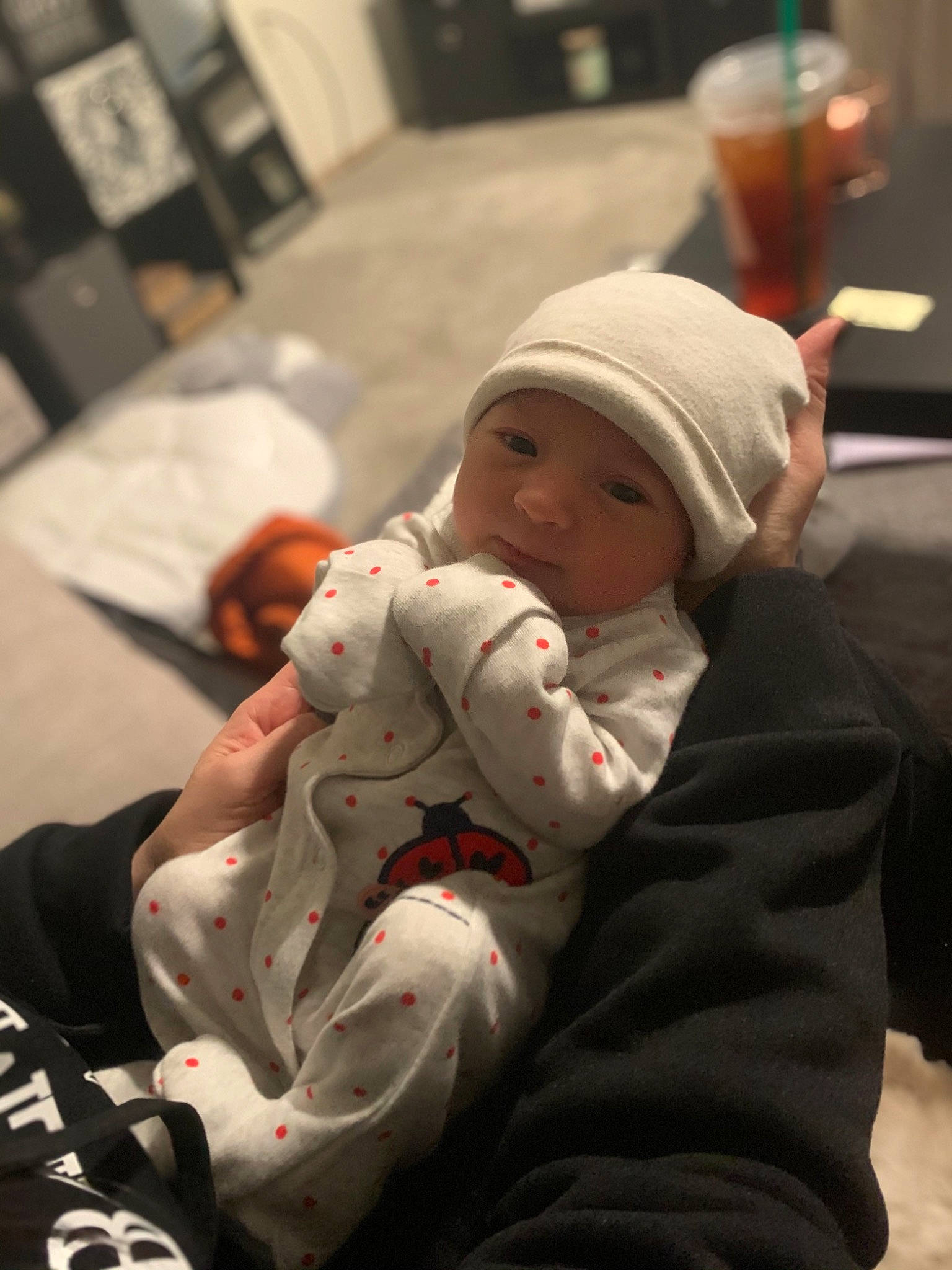 Ainsley is registered to the contest to win money with this photo: baby, baby_products, baby_toddler_clothing, cap, carmine, cheek, child, christmas, christmas_eve, comfort, headwear, lap, person, room, sitting, skin, toddler, winter