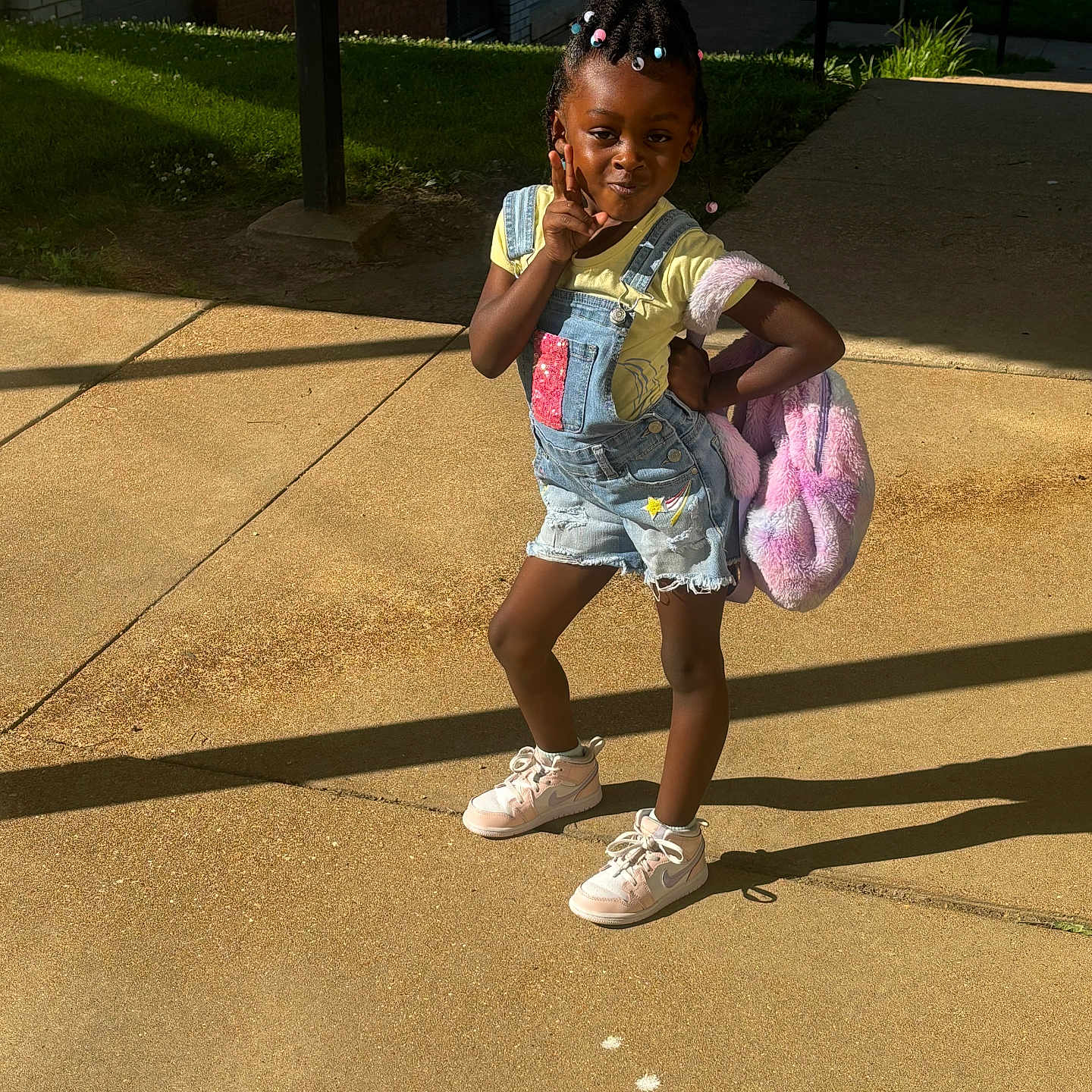 Paisley is registered to the contest to win money with this photo: car, child, clothing, face, female, footwear, girl, head, path, person, photography, portrait, sandal, shoe, shorts, sneaker, transportation, vehicle, walking, walkway