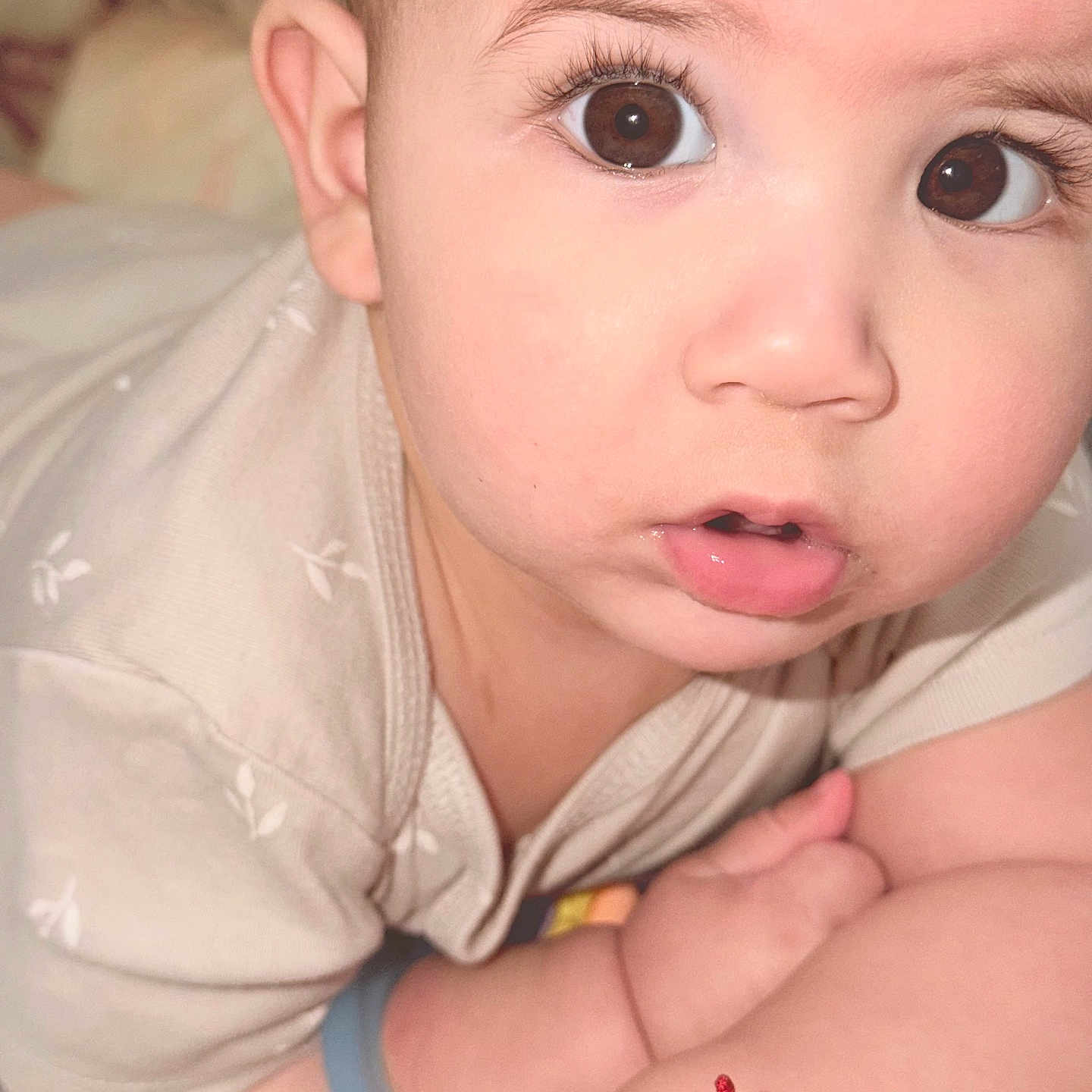 Lucas joined the competition — help win amazing prizes! baby, child, infant, close_up, portrait, face, eyes, wide_eyes, brown_eyes, eyelashes, short_hair, open_mouth, curious, indoors, bed, blanket, clothing, arms, bracelet, photography
