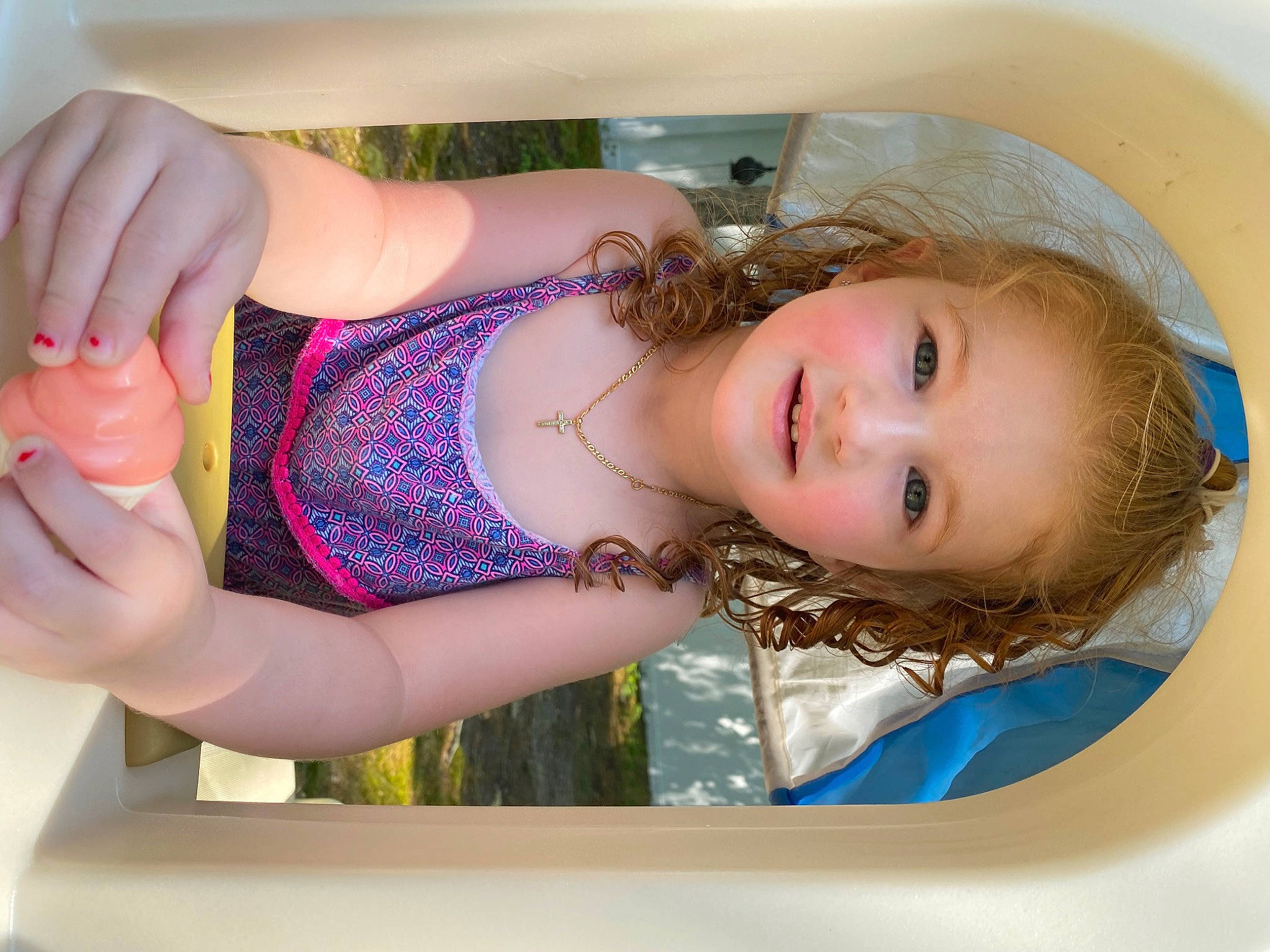 Emmersyn is registered to the contest to win money with this photo: bathing, blond, chest, child, dress, electric_blue, eyelash, facial_expression, finger, hairstyle, hand, happy, human_leg, joy, long_hair, person, pink, skin, smile, thigh