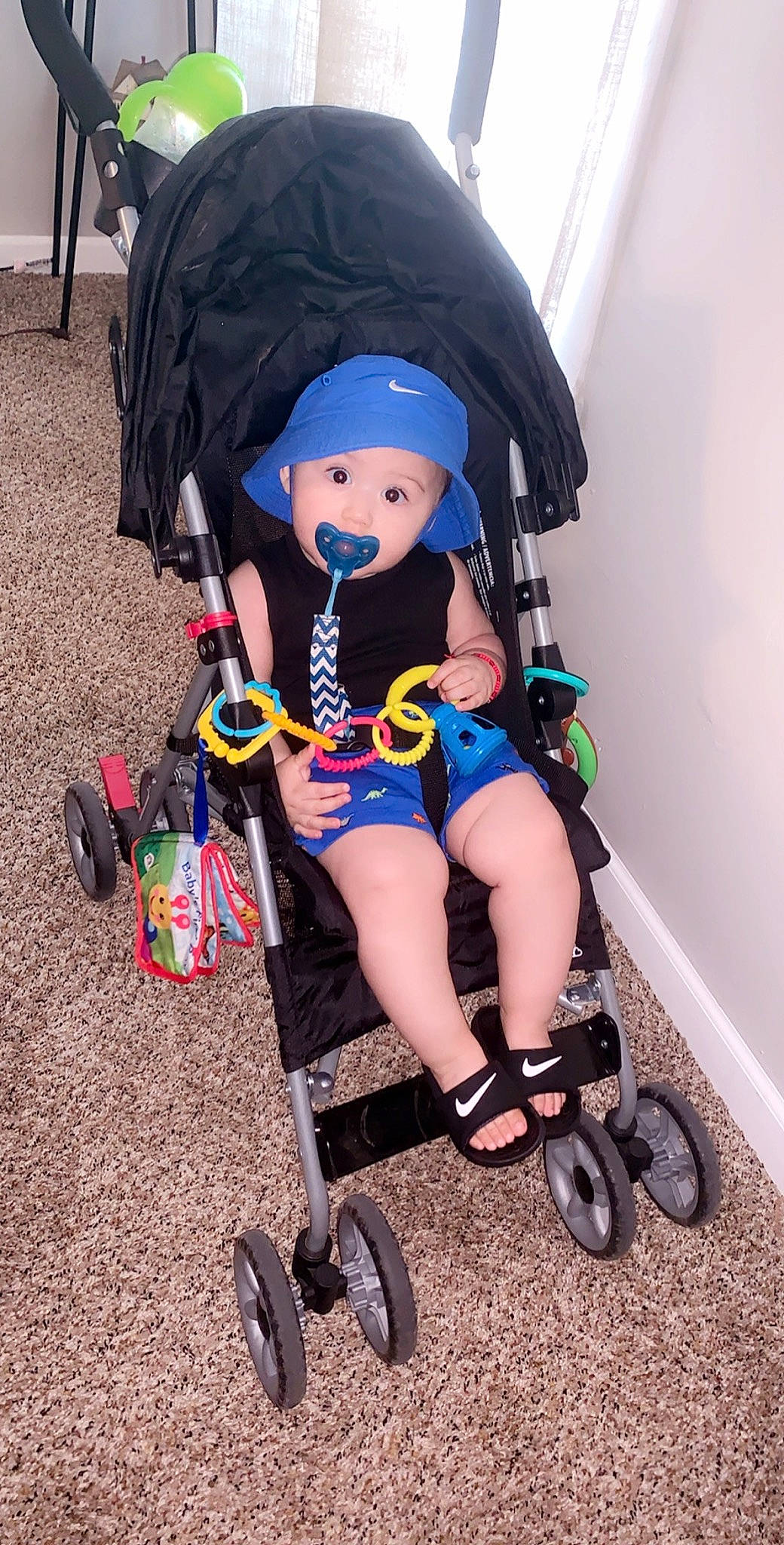 Francisco is registered to the contest to win money with this photo: baby_carriage, baby_products, child, headwear, person, product, toy, vehicle