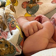 Nikolai joined the competition — help win amazing prizes! baby, arm, hand, fist, blanket, pattern, animal_print, soft, skin, closeup, infant, cute, cozy, resting, colorful, fabric, texture, child, newborn, toddler