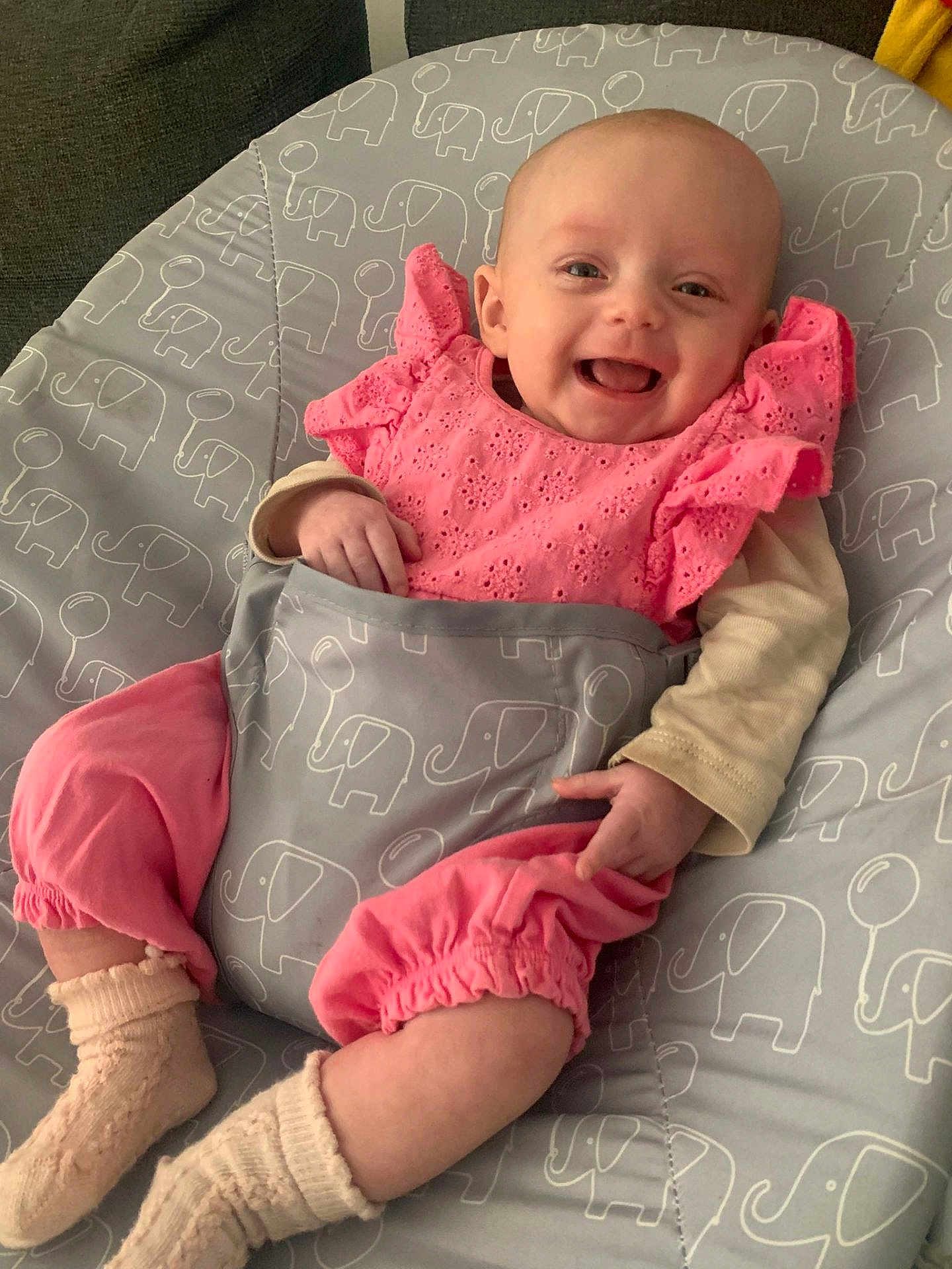 Thea-Rose joined the competition — help win amazing prizes! baby, infant, smiling, pink_clothing, sock, cushion, elephant_pattern, happy, cute, child, laying_down, indoor, portrait, soft_lighting, baby_clothes, person, baby_girl, fabric, comfort, young_child