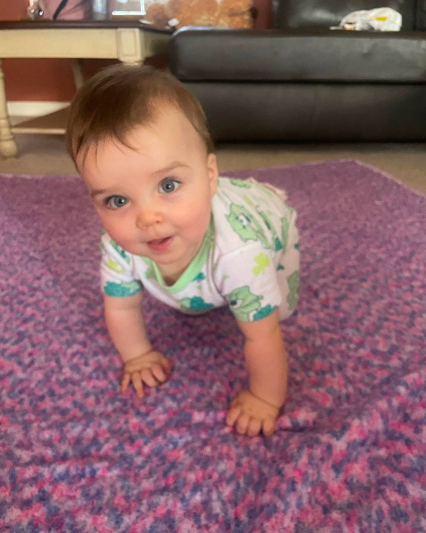 Amelia is registered to the contest to win money with this photo: baby, baby_toddler_clothing, carpet, cheek, child, chin, comfort, crawling, finger, floor, flooring, fun, grass, hardwood, head, person, room, skin, smile, toddler