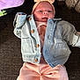 Arya joined the competition — help win amazing prizes! adorable, baby, blanket, child, clothing, comfortable, cozy, cute, denim_jacket, floral_pattern, headband, headwear, indoor, infant, lying_down, pink_pants, portrait, soft_texture, warm_clothing, young