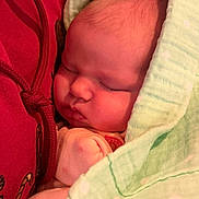 Breylynne is registered to the contest to win money with this photo: baby, sleeping, blanket, red_hoodie, infant, face, soft, cozy, closeup, skin, peaceful, wrapped, newborn, child, cute, cuddled, warm, portrait, resting, comfort