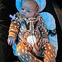 Breylynne is registered to the contest to win money with this photo: baby, infant, onesie, deer_pattern, cushion, pacifier, baby_seat, clothing, cute, sleepwear, child, indoors, soft_fabric, relaxing, newborn, face, hands, feet, portrait, comfort