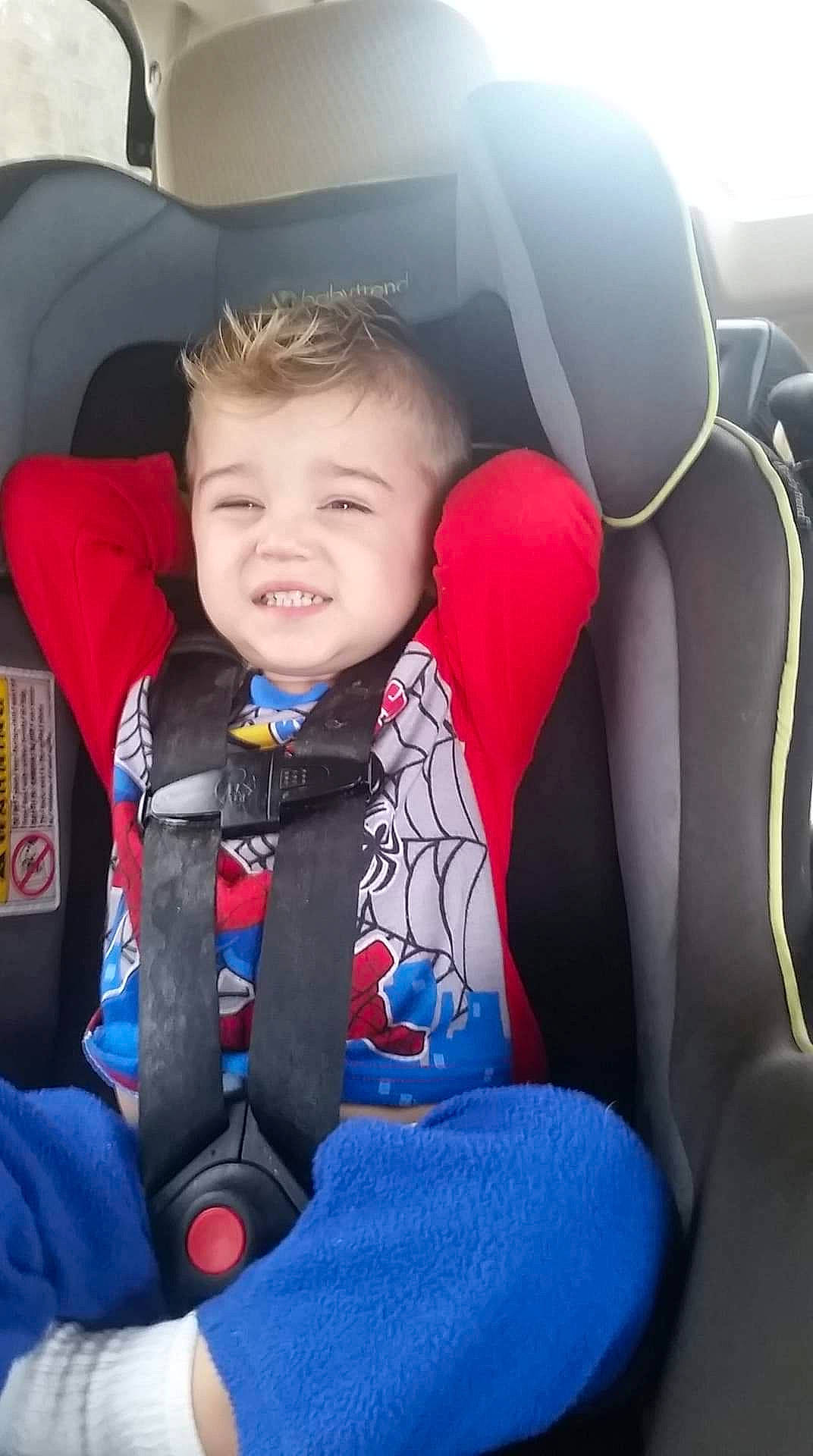 Samuel is registered to the contest to win money with this photo: auto_part, baby, baby_in_car_seat, car, car_seat, car_seat_cover, child, fun, head, joy, person, product, seat_belt, sitting, smile, toddler