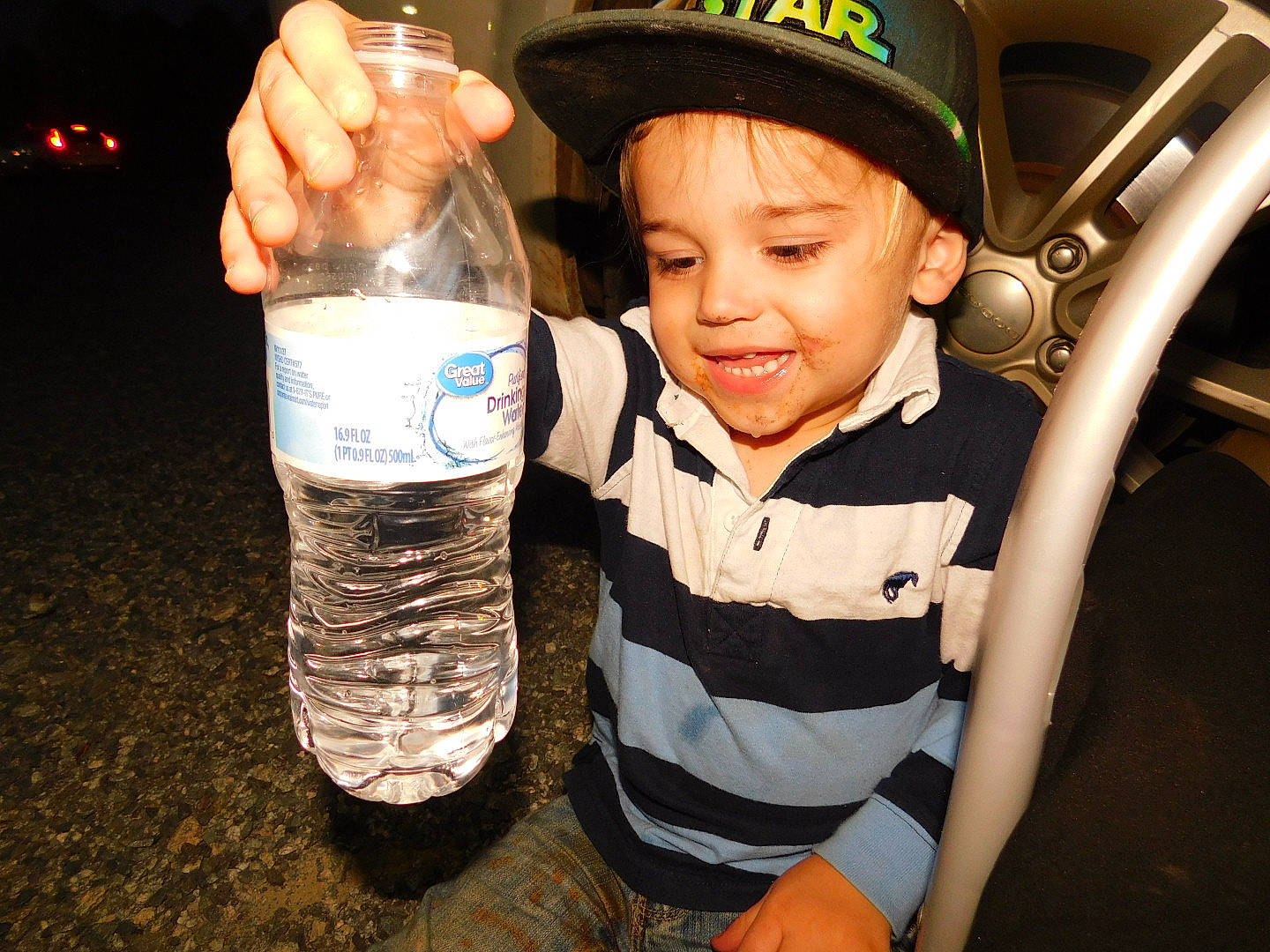 Samuel is registered to the contest to win money with this photo: child, drink, finger, fun, hand, joy, person, smile, thumb, water