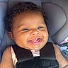 Majesty joined the competition — help win amazing prizes! baby, child, infant, smiling, happy, laughing, portrait, car_seat, seatbelt, harness, vehicle, travel, indoors, close_up, face, curly_hair, sitting, pink_clothing, blanket, safe