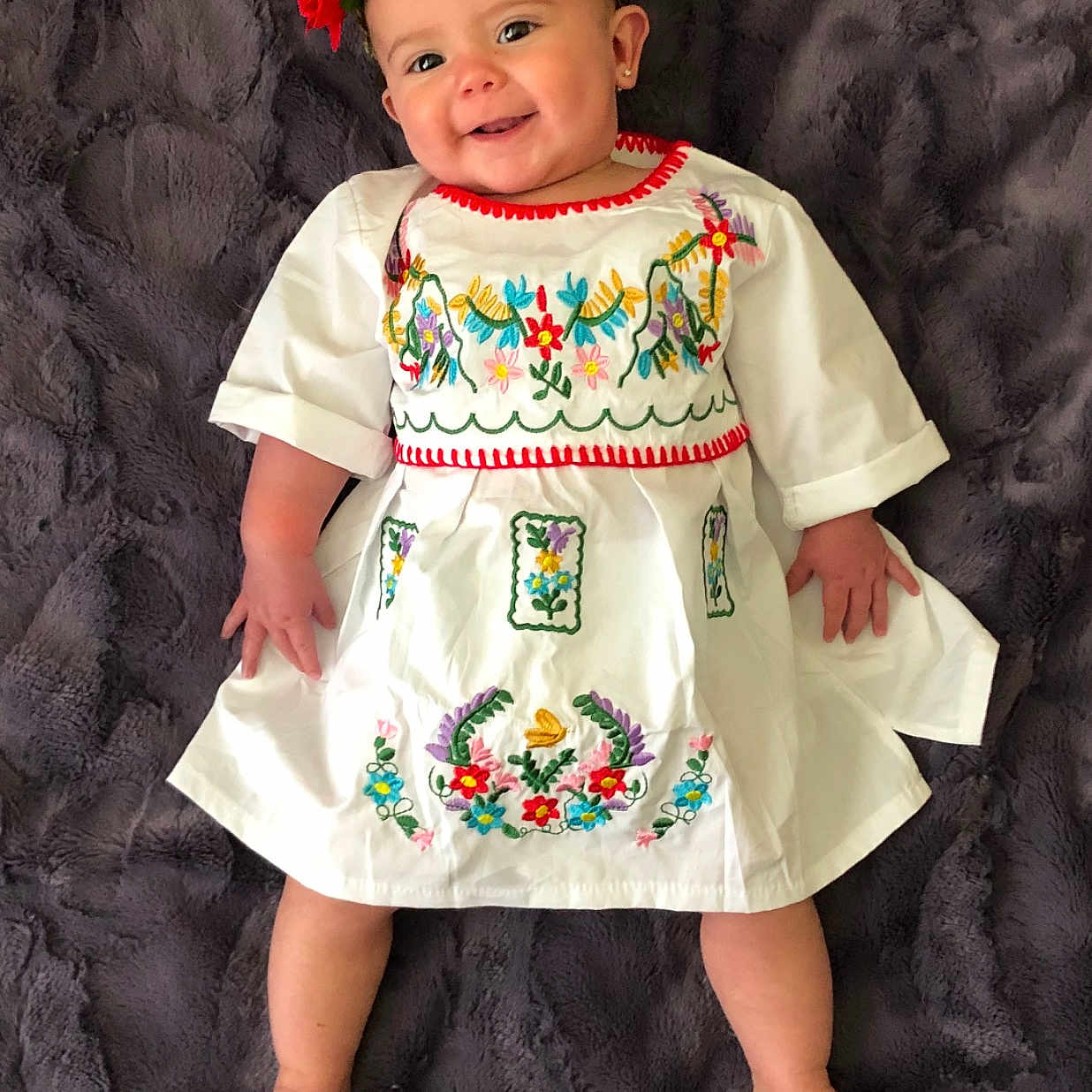 Reyna joined the competition — help win amazing prizes! baby_products, baby_toddler_clothing, child, child_model, clothing, dress, hair_accessory, joy, pattern, person, product, sleeve, textile, toddler