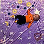 Natalia joined the competition — help win amazing prizes! baby, child, cute, decorative_blanket, face, halloween, head, holiday, indoor, infant, lying_down, numbers, orange_clothing, pattern, person, portrait, purple_blanket, small, socks, stars