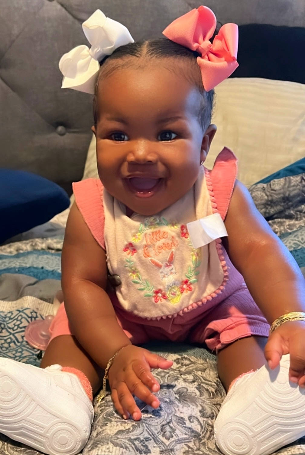 Emori joined the competition — help win amazing prizes! baby, baby_toddler_clothing, child, comfort, event, face, facial_expression, fun, gesture, happy, head, joy, leisure, mouth, person, pink, recreation, sitting, skin, smile