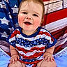 Luca joined the competition — help win amazing prizes! baby, child, smiling, happy, american_flag, clothing, portrait, cute, sitting, face, hair, background, red, white, blue, pattern, toddler, blanket, skin, funny_hair