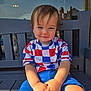 toddler, child, smiling, bench, outdoor, shirt, shorts, colorful_clothing, reflection, window, sunlight, hair, portrait, casual, happy, sitting, daylight, person, face, young_child