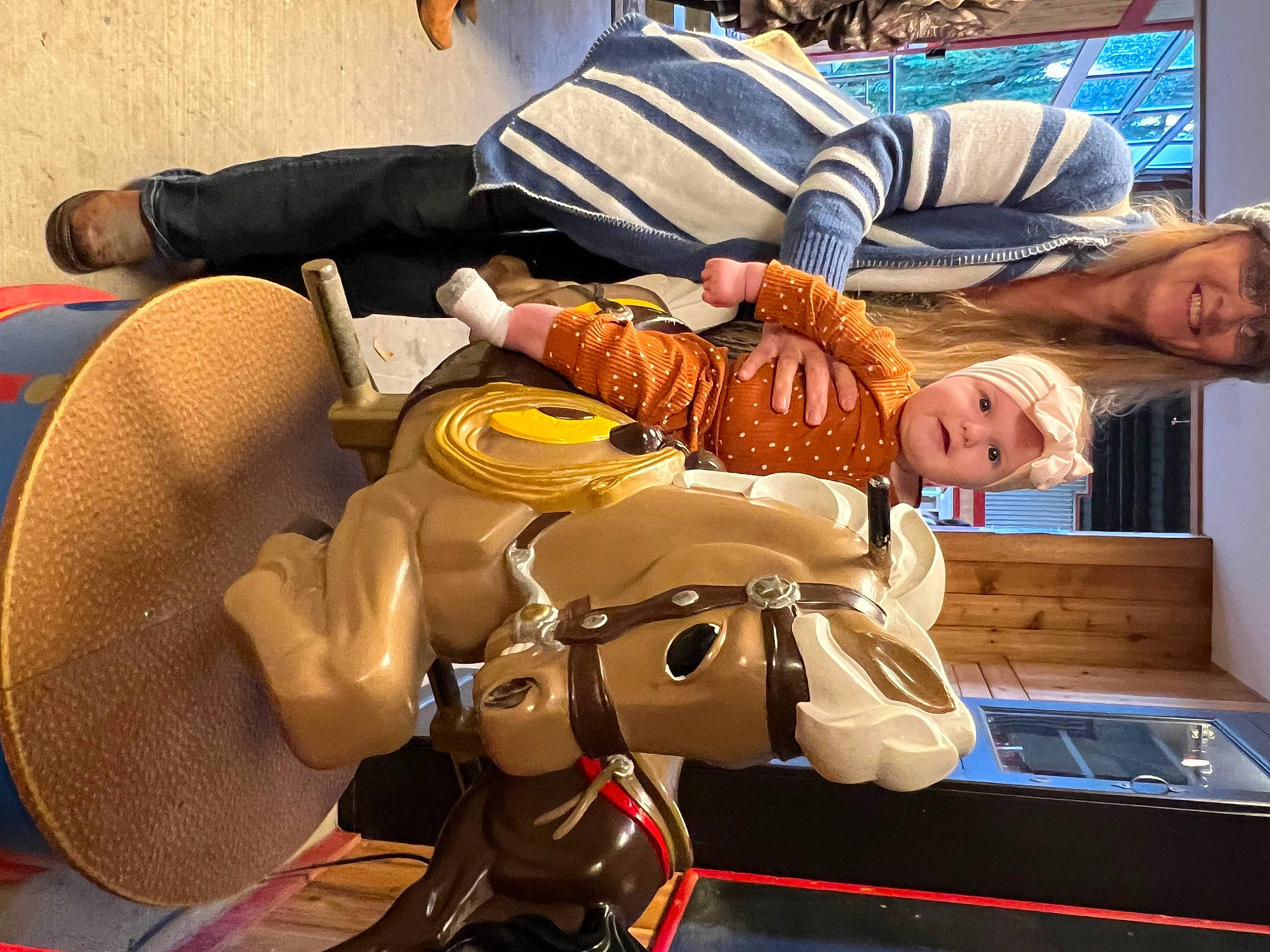 Mavis is registered to the contest to win money with this photo: bag, child, comfort, fun, hat, headwear, human_leg, joy, leisure, luggage_and_bags, motor_vehicle, passenger, person, personal_protective_equipment, recreation, sitting, team, television, thigh, transport