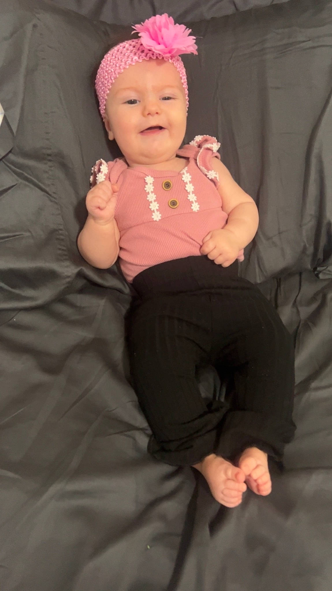 Mavis is registered to the contest to win money with this photo: baby, baby_toddler_clothing, cap, comfort, eye, finger, gesture, glasses, hand, happy, hat, head, headwear, human_body, lip, person, pink, skin, sleeve, smile