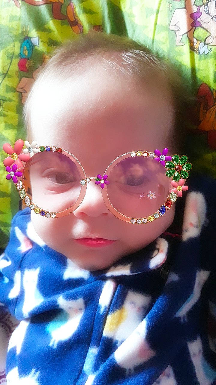 Kambria is registered to the contest to win money with this photo: cheek, child, cool, ear, eyewear, face, forehead, fun, glasses, head, lip, nose, person, pink, smile, sunglasses, toddler, vision_care
