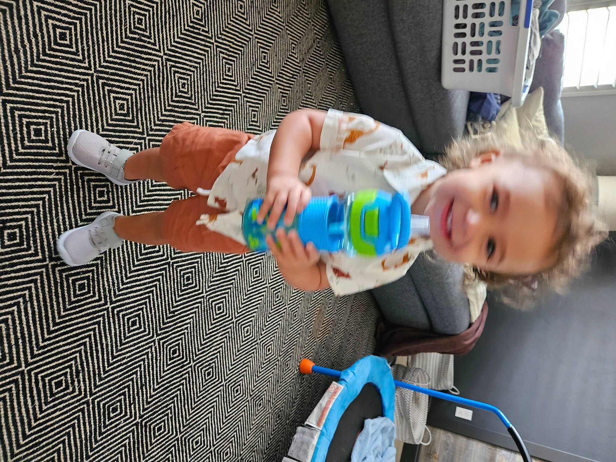 Leighton is registered to the contest to win money with this photo: baby, baby_products, child, electric_blue, finger, fun, hand, happy, joy, leisure, nail, person, play, recreation, sitting, smile, thumb, tire, toddler, toy