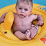 Wayne participe au concours pour gagner de l'argent avec cette photo : baby, infant, pool, water, float, inflatable, yellow, blue, child, skin, feet, hands, summer, outdoor, cute, swimming, fun, wet_hair, sitting, play
