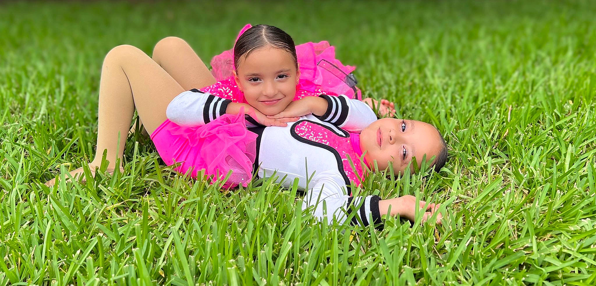 Lee And Kay is registered to the contest to win money with this photo: black_hair, face, flash_photography, fun, grass, grass_family, grassland, happy, joy, lawn, leisure, magenta, meadow, people, people_in_nature, person, plant, prairie, recreation, smile
