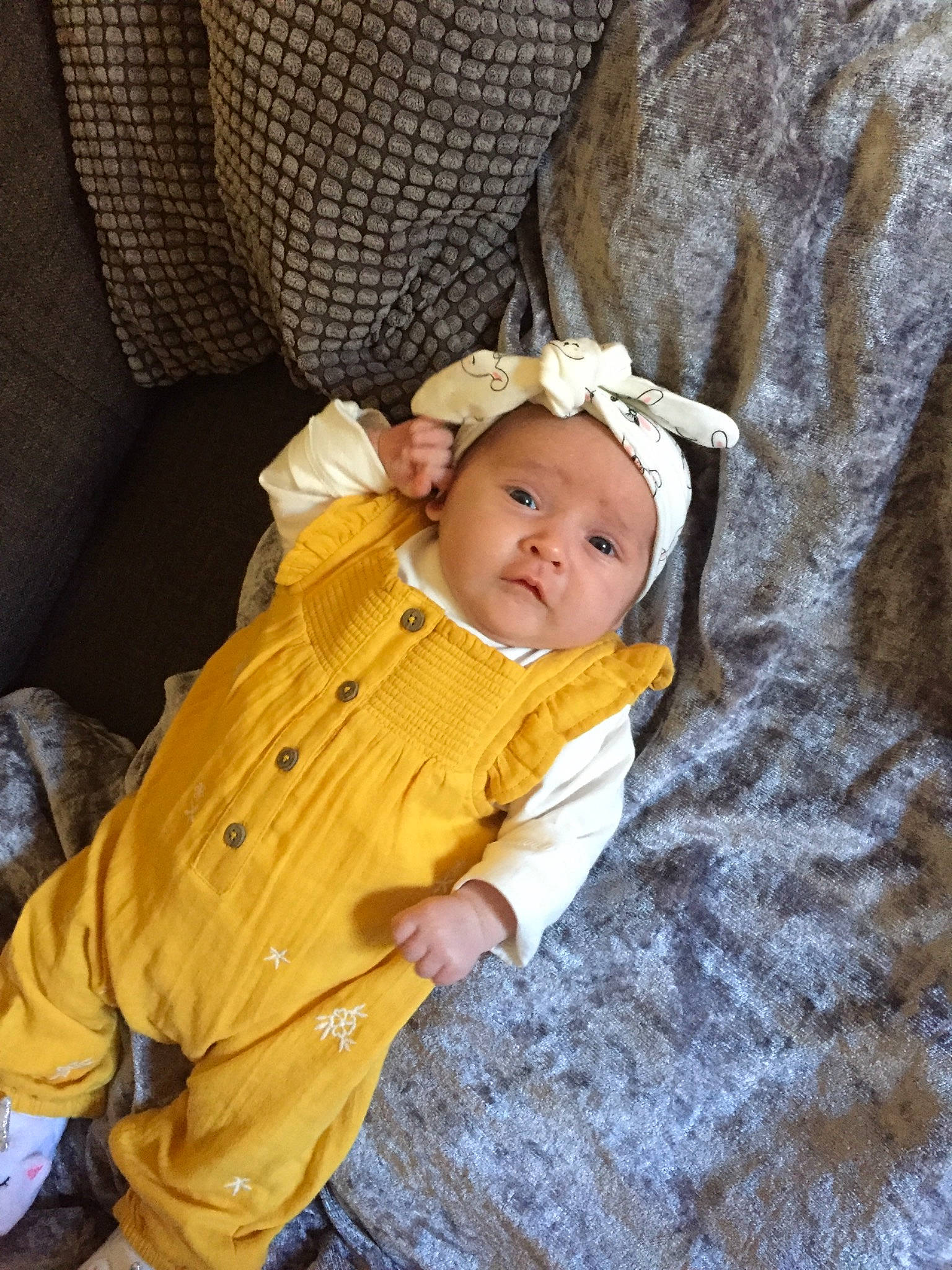 Dottie is registered to the contest to win money with this photo: baby, child, headwear, outerwear, person, skin, toddler, tree, yellow