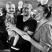Kyson is registered to the contest to win money with this photo: child, toddler, man, woman, smile, laugh, family, balloon, celebration, party, black_and_white, portrait, people, clothing, indoor, event, happy, casual, holding, together