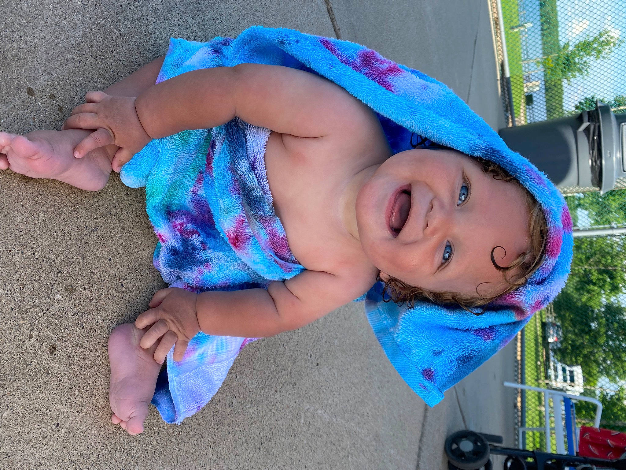 Lux is registered to the contest to win money with this photo: azure, baby, baby_toddler_clothing, blue, child, electric_blue, fun, grass, happy, hat, headwear, leisure, mouth, nose, person, pink, plant, skin, sun_hat, tire