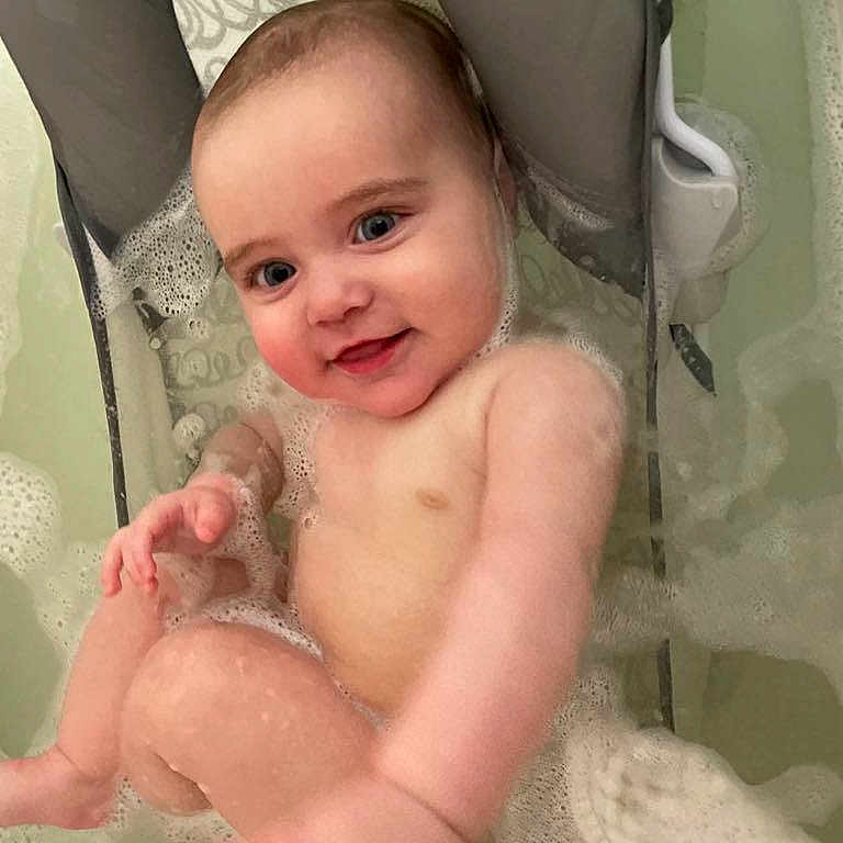 Mia joined the competition — help win amazing prizes! baby, babylaughing, bathing, bathtub, face, happy, head, infantbed, newborn, person, photography, portrait, smile, tub