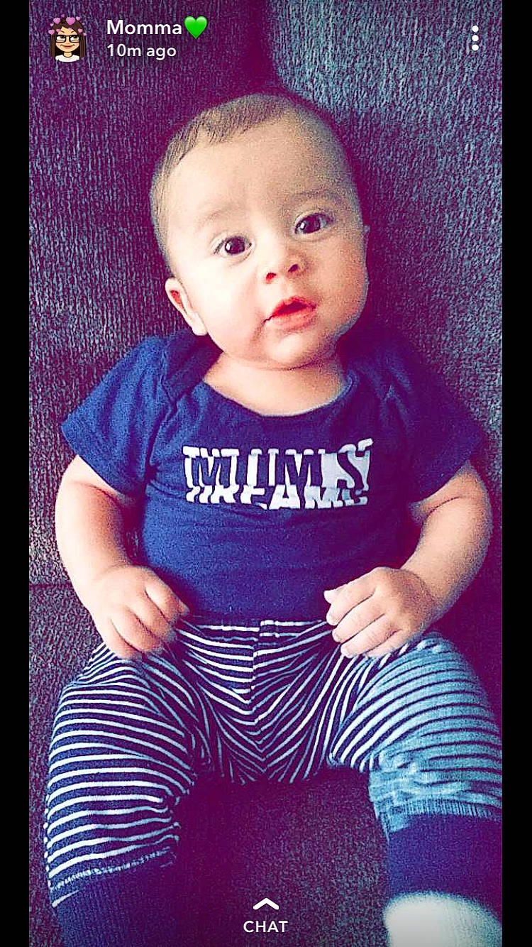 Jesse Miguel is registered to the contest to win money with this photo: baby, baby_products, baby_toddler_clothing, cheek, child, child_model, eye, face, head, lip, person, photography, pink, portrait, product, purple, skin, sleeve, smile, t_shirt