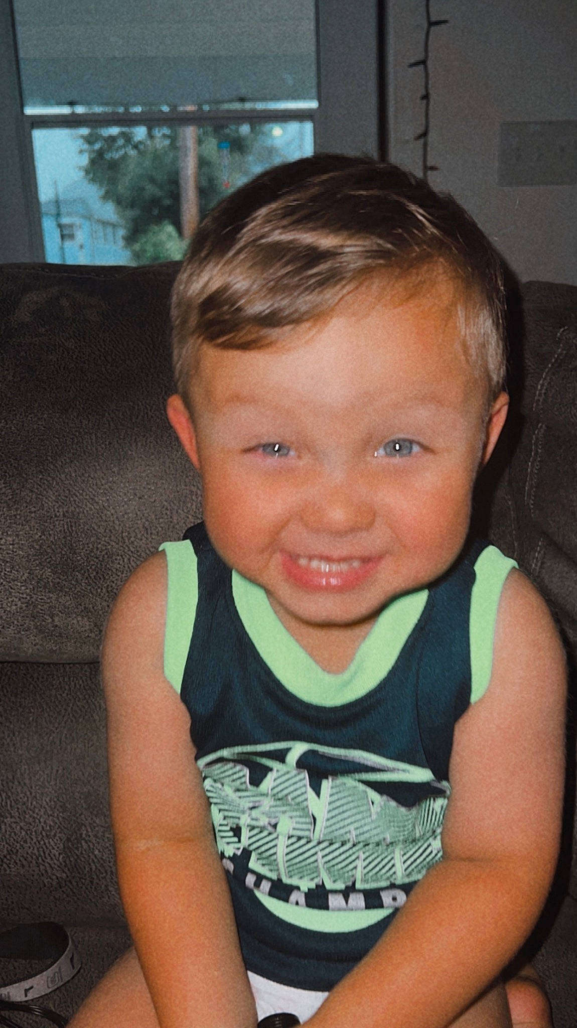 Winston is registered to the contest to win money with this photo: arm, chair, cheek, chin, ear, eye, eyebrow, eyelash, face, forehead, happy, head, human_body, iris, jaw, joy, mouth, neck, nose, person