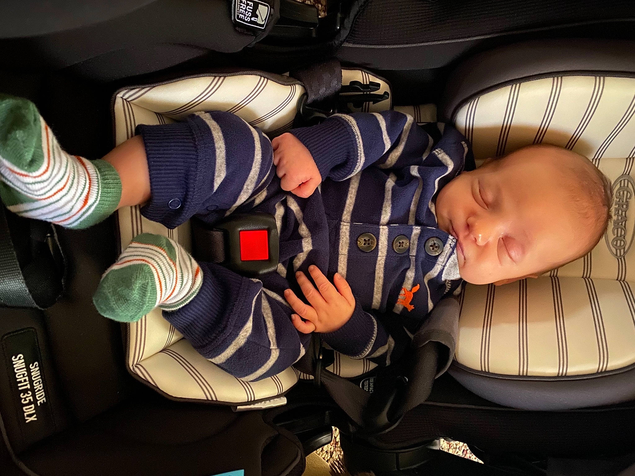 Kohen is registered to the contest to win money with this photo: arm, auto_part, automotive_design, car_seat, car_seat_cover, comfort, cool, flash_photography, gesture, hand, headgear, leg, motor_vehicle, person, shoe, sneakers, sports_gear, steering_wheel, toddler, vehicle