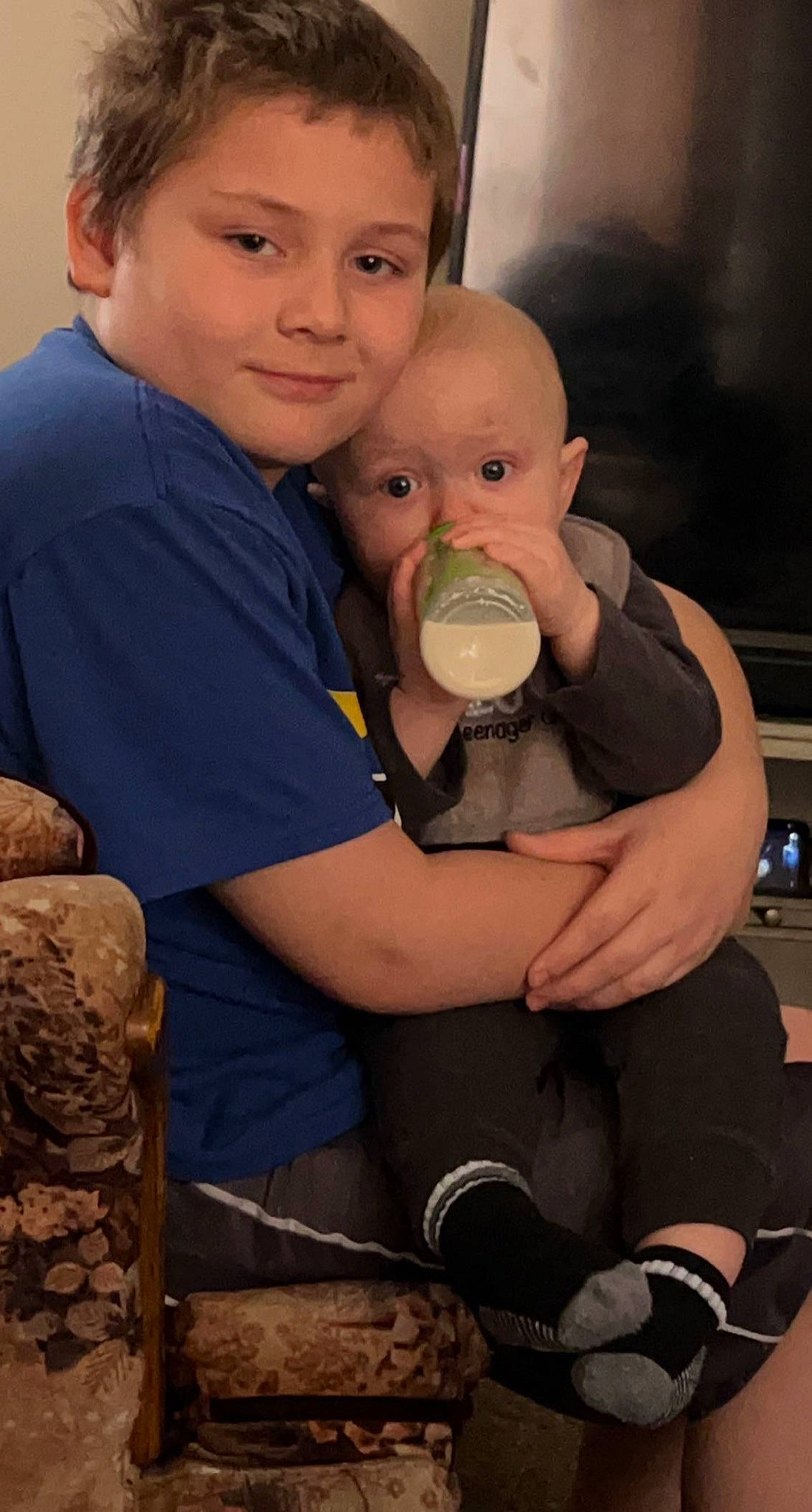 Christopher is registered to the contest to win money with this photo: baby, child, drink, drinking, drinkware, eye, facial_expression, finger, fun, hairstyle, hand, happy, human, joint, muscle, people, person, plastic_bottle, skin, t_shirt