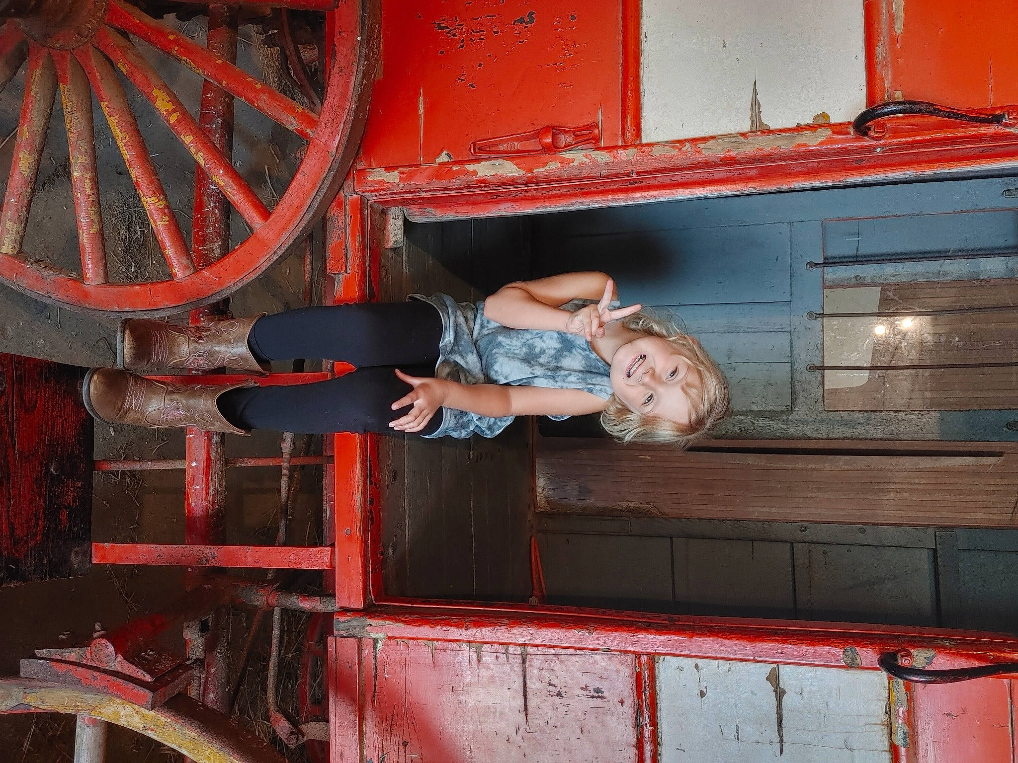 Alana is registered to the contest to win money with this photo: auto_part, automotive_design, automotive_exterior, automotive_tire, automotive_wheel_system, engineering, gas, joy, machine, metal, motor_vehicle, person, rim, rolling, smile, t_shirt, tire, train, vehicle, vehicle_door