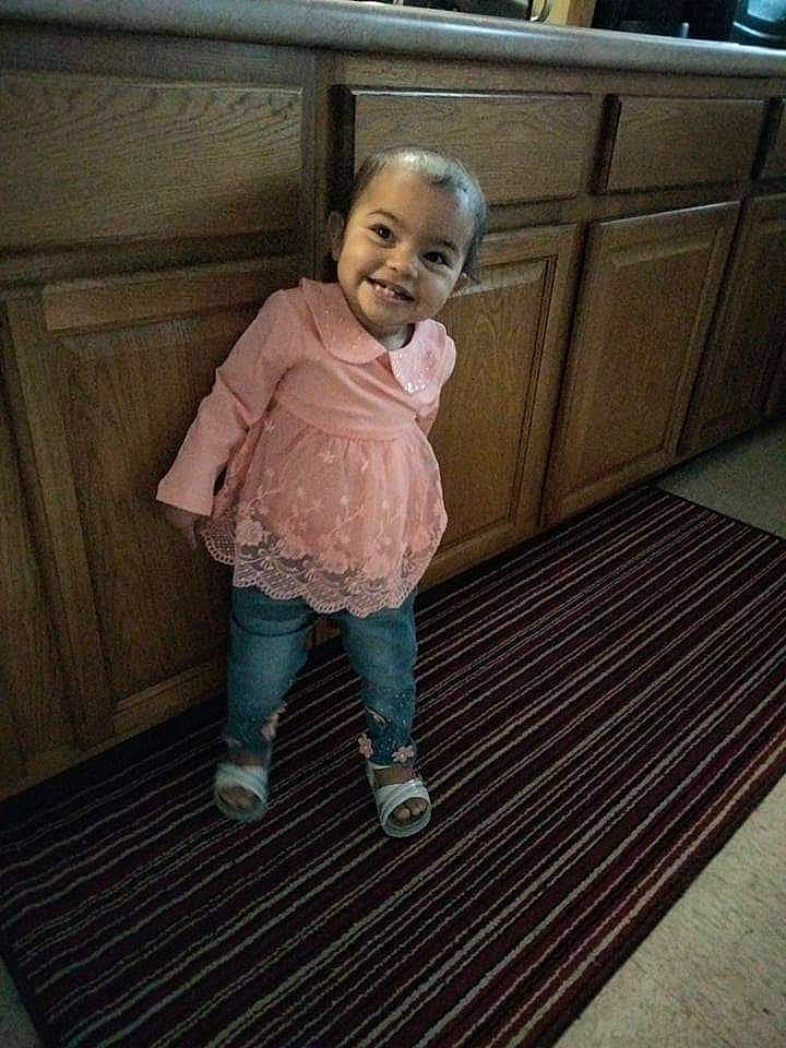 Jazlyn is registered to the contest to win money with this photo: baby, baby_products, baby_toddler_clothing, cheek, child, clothing, face, floor, flooring, fun, hardwood, joy, leg, pattern, person, play, room, sitting, sleeve, smile