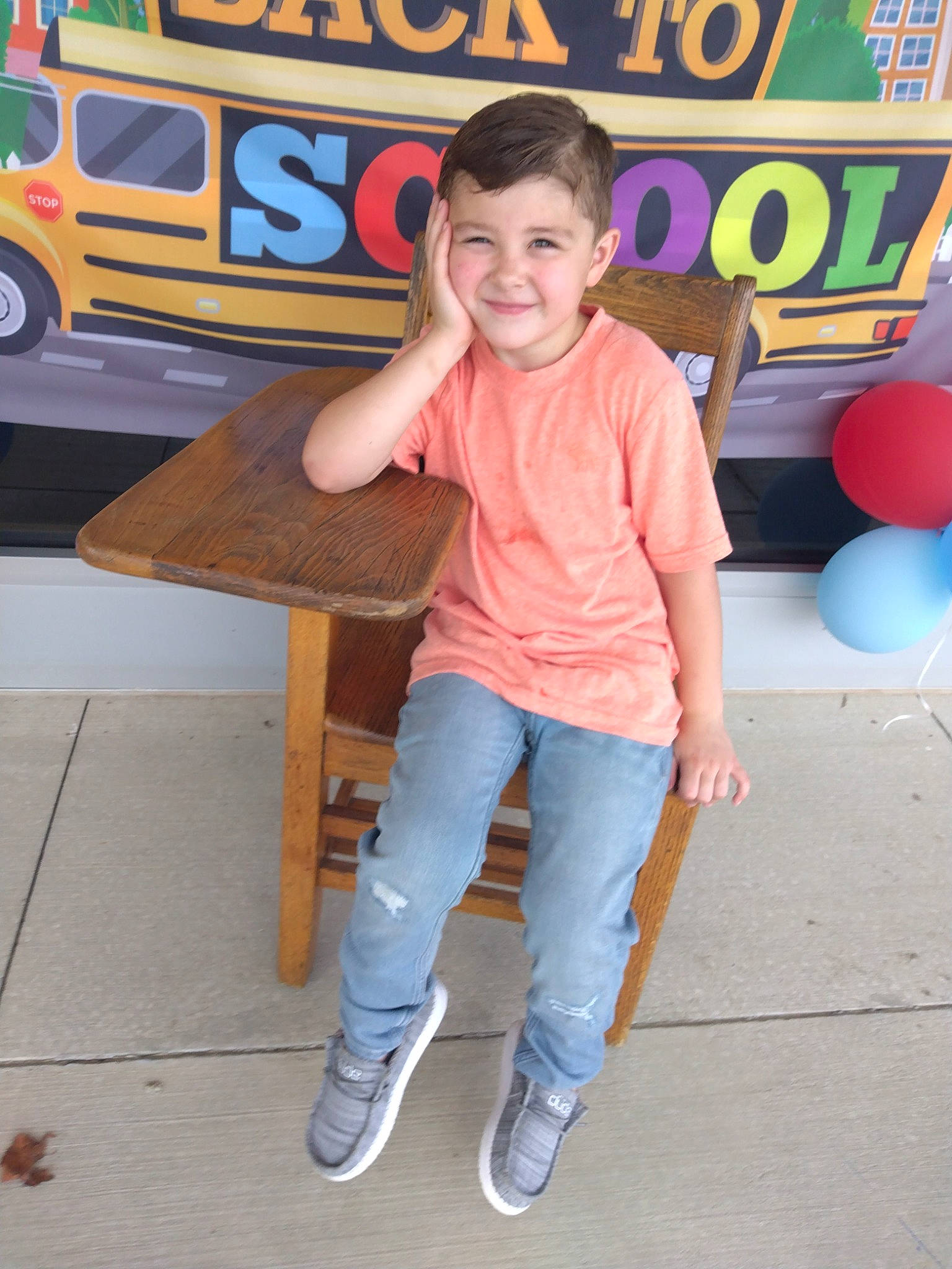 Roman joined the competition — help win amazing prizes! automotive_exterior, balloon, child, denim, electric_blue, family_car, fun, happy, joy, leisure, logo, motor_vehicle, person, play, recreation, sitting, sleeve, smile, standing, t_shirt