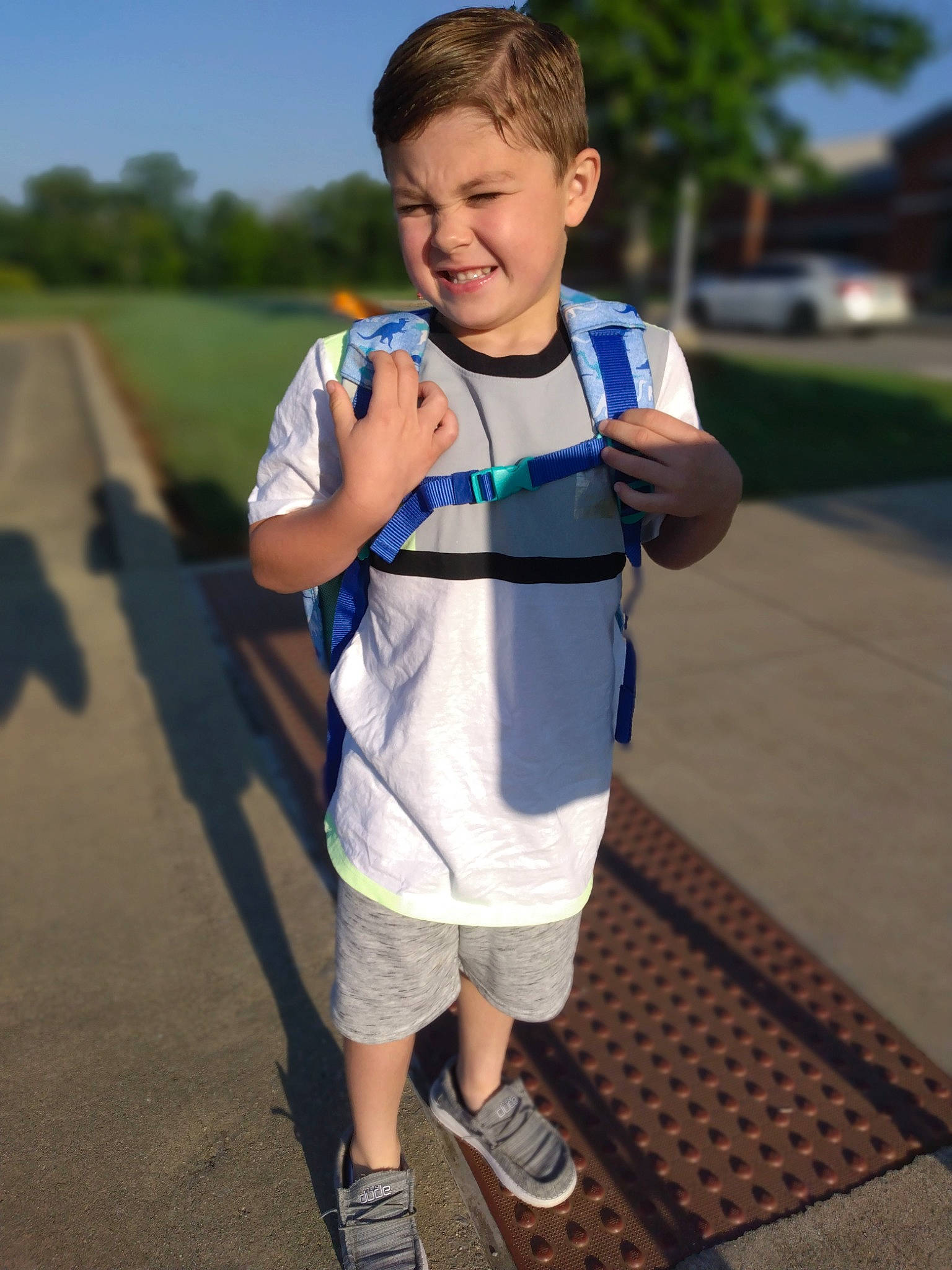 Roman is registered to the contest to win money with this photo: asphalt, child, electric_blue, endurance_sports, fun, grass, joy, leisure, pattern, person, plant, recreation, running, shorts, sky, sleeve, smile, summer, t_shirt, toddler