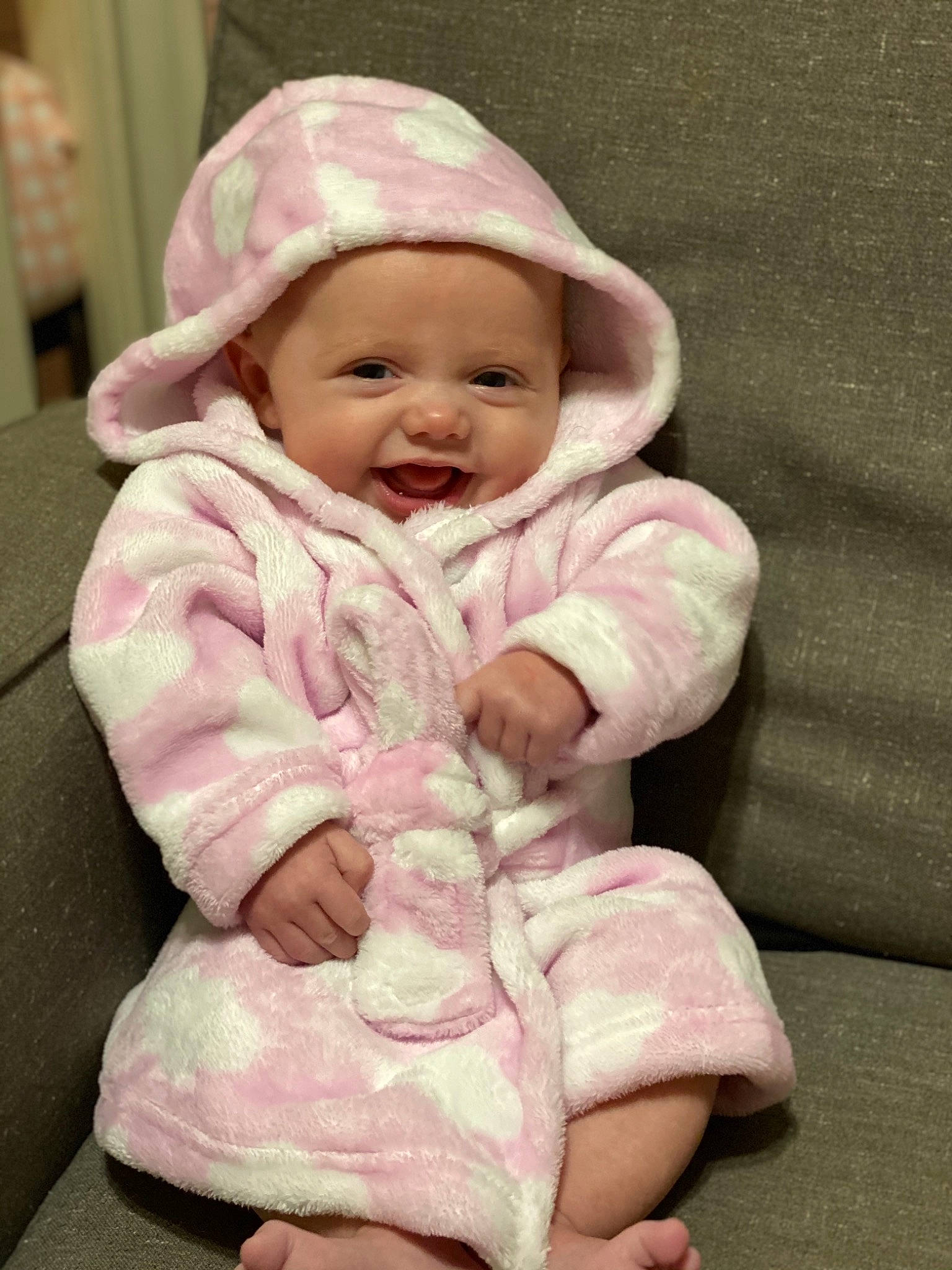 Mavis is registered to the contest to win money with this photo: baby, baby_toddler_clothing, cap, cheek, child, comfort, face, happy, head, headgear, headwear, jacket, linens, lip, magenta, outerwear, person, pink, skin, sleeve