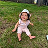 Eliana is registered to the contest to win money with this photo: baby, child, grass, outdoor, hat, smile, sitting, person, nature, sunhat, greenery, happy, cute, young, casual_clothing, daylight, playful, infant, portrait, lawn