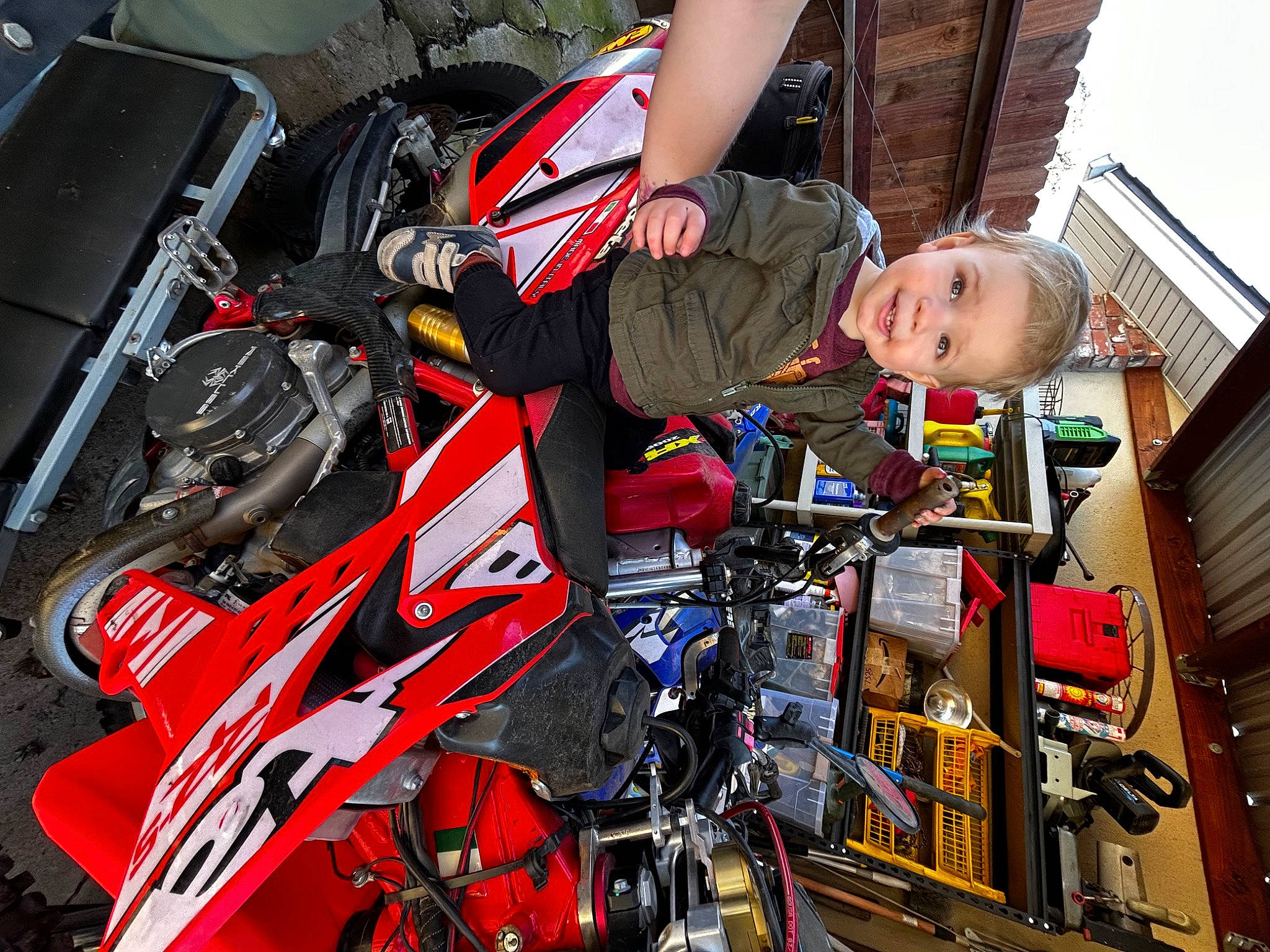 Judah joined the competition — help win amazing prizes! auto_part, automotive_design, automotive_exterior, automotive_lighting, automotive_tire, automotive_wheel_system, building, carmine, motor_vehicle, motorcycle, motorcycle_accessories, motorcycling, motorsport, person, personal_protective_equipment, racing, sky, t_shirt, tire, vehicle