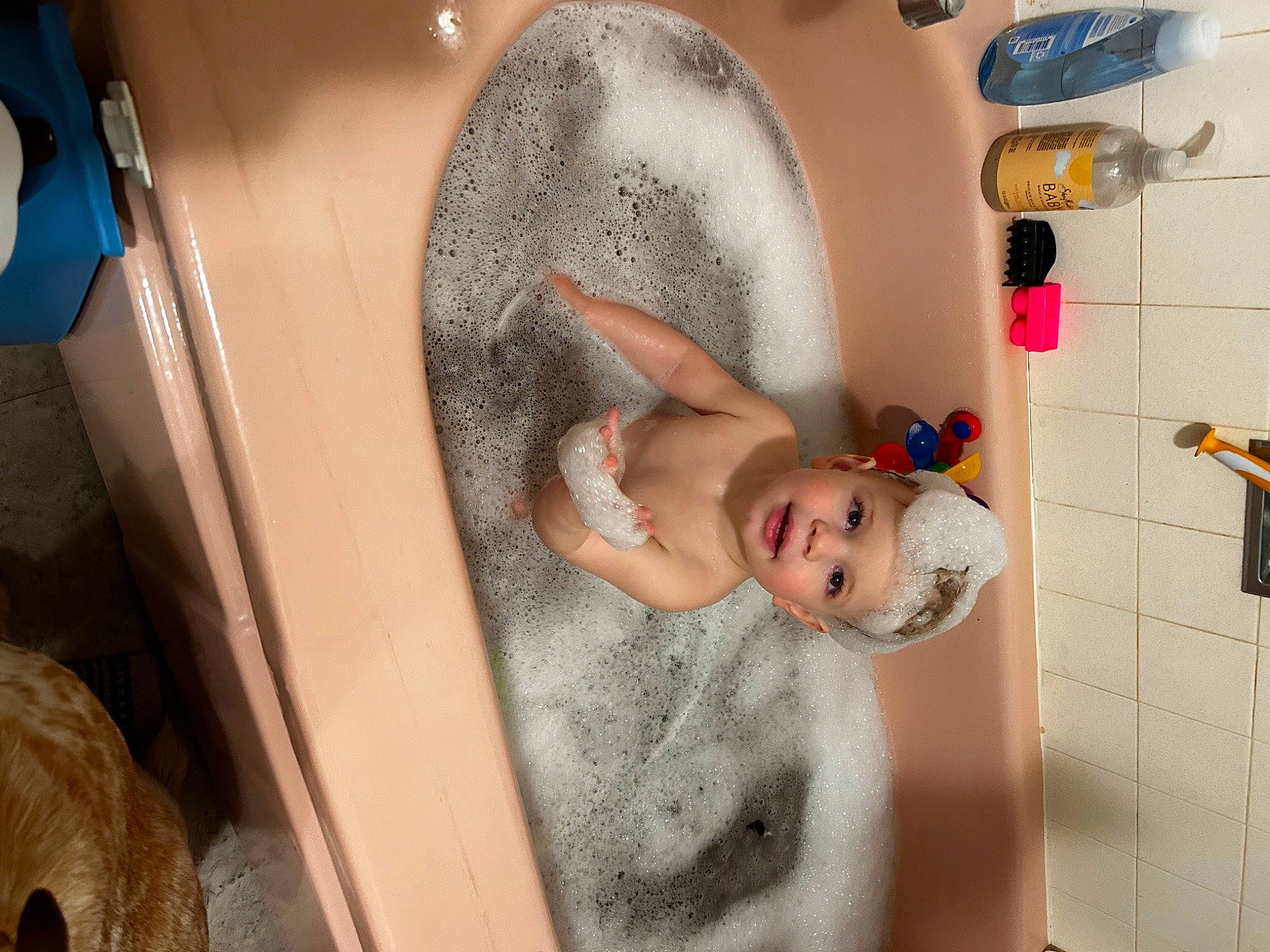 Judah is registered to the contest to win money with this photo: baby, baby_products, bathing, bathroom, chest, child, circle, comfort, eyelash, fun, hairstyle, happy, headwear, mouth, person, plumbing, plumbing_fixture, room, skin, smile