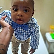 Kaizen joined the competition — help win amazing prizes! toddler, child, boy, blue_bow_tie, checkered_shirt, khaki_pants, brown_shoes, hand, portrait, indoor, person, cute, fashion, standing, looking_up, skin, short_hair, expression, baby, holding