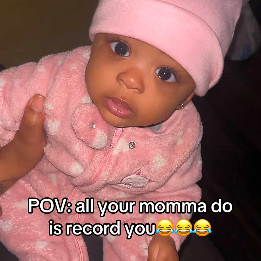 Zynori joined the competition — help win amazing prizes! baby, child, pink_hat, pink_outfit, infant, cute, indoor, hand, face, eyes, expression, clothing, person, portrait, young_child, cozy, looking_up, sitting, home, adorable